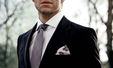 Man wearing a pocket square in a suit jacket breast pocket