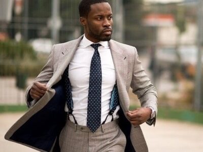 Man wearing suspenders with a formal suit and tie