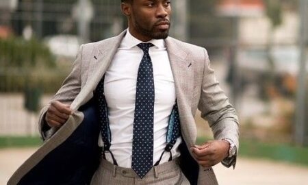 Man wearing suspenders with a formal suit and tie