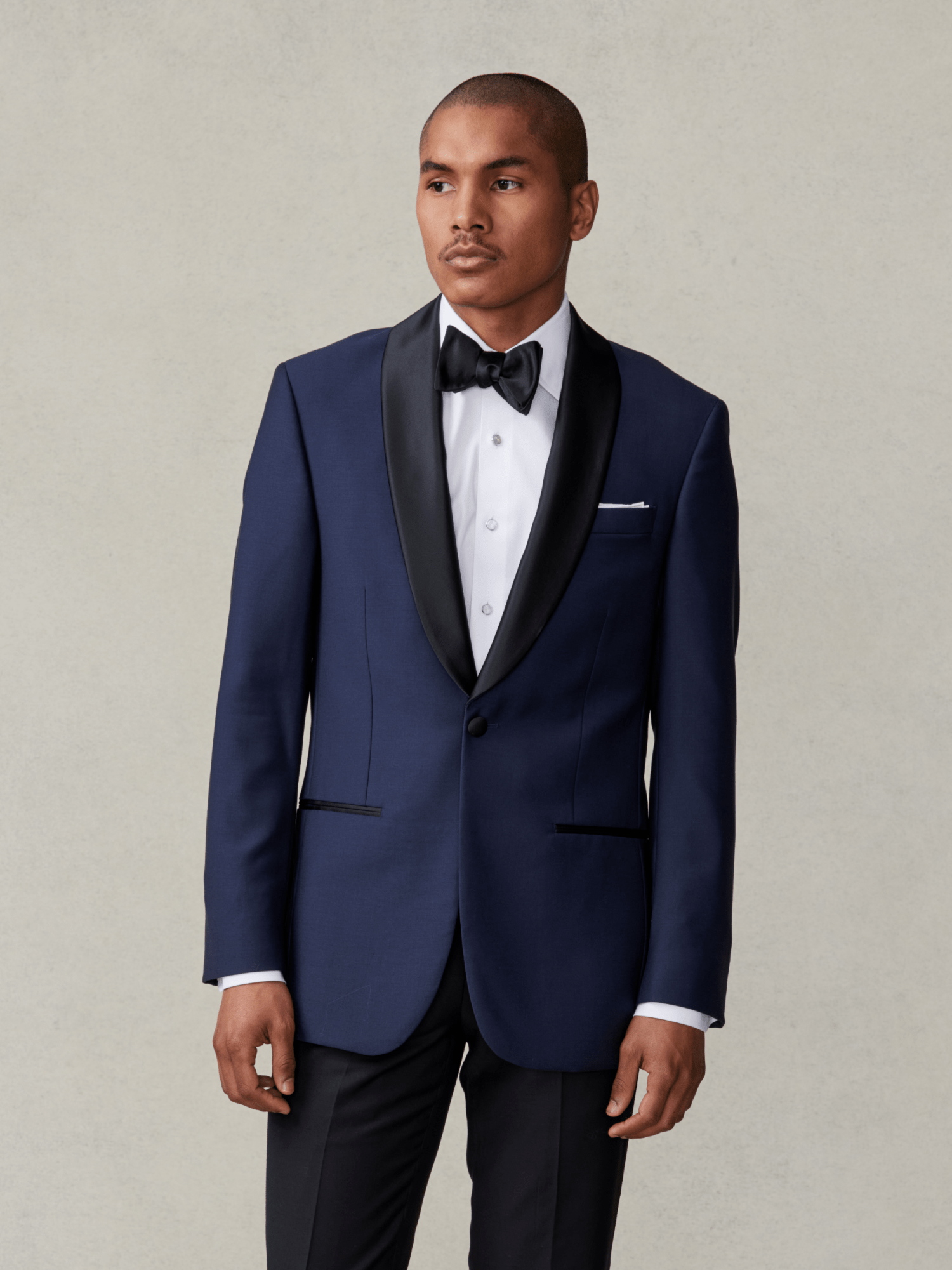 Man wearing a classic black tuxedo with bow tie