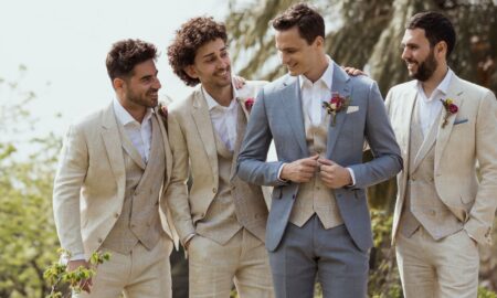 Men in wedding suits - groomsmen wearing linen suits at an outdoor wedding